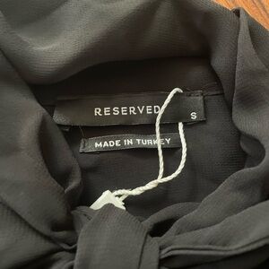 Beautiful bow, sheer blouse, never used